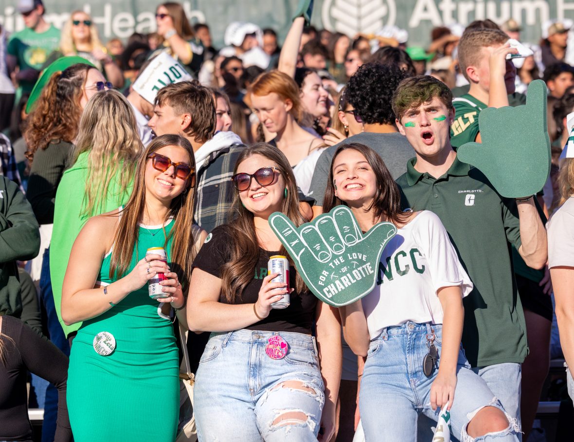 Students at homecoming showing their Niner Pride