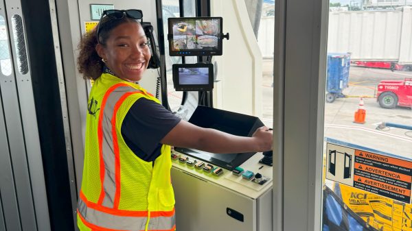 Myla working at the airport