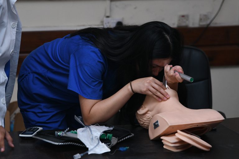 Zihiu practicing on a test dummy